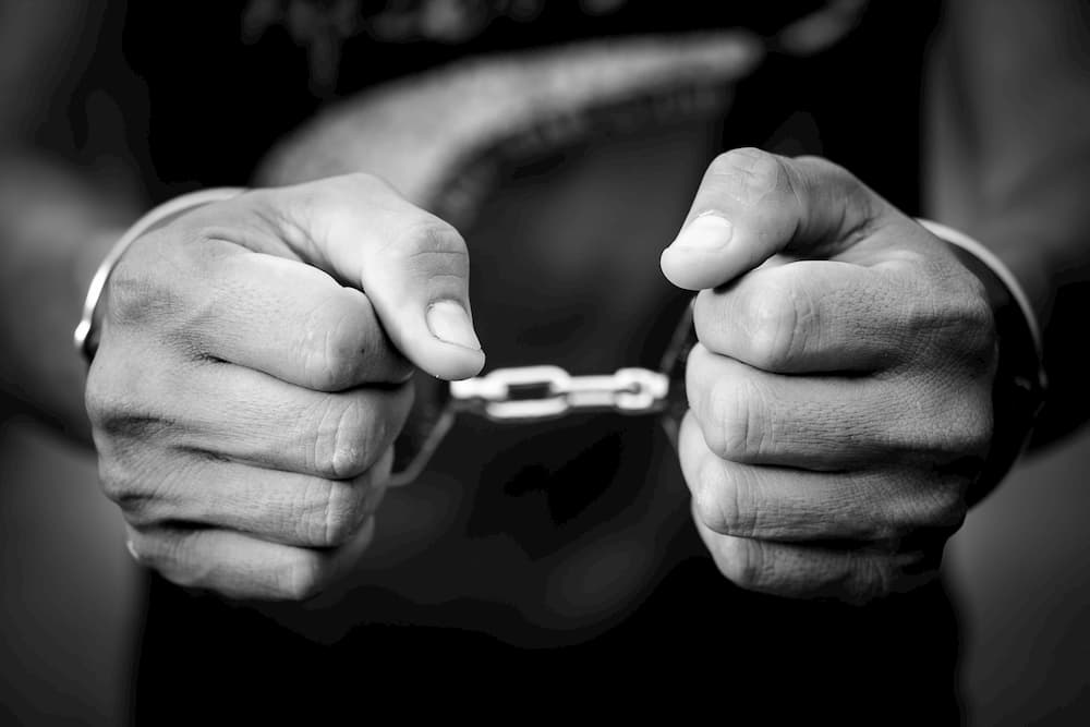 Man's handcuffed hands