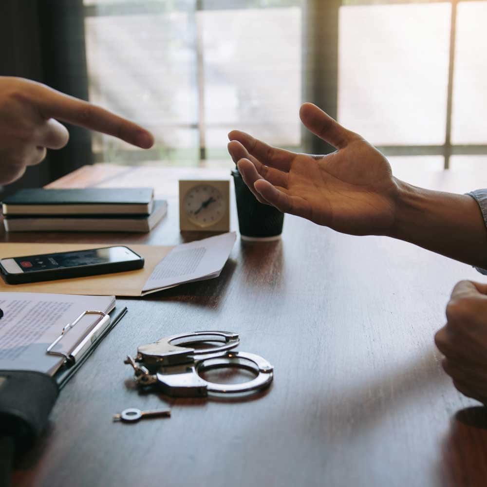 Attorney and client at desk